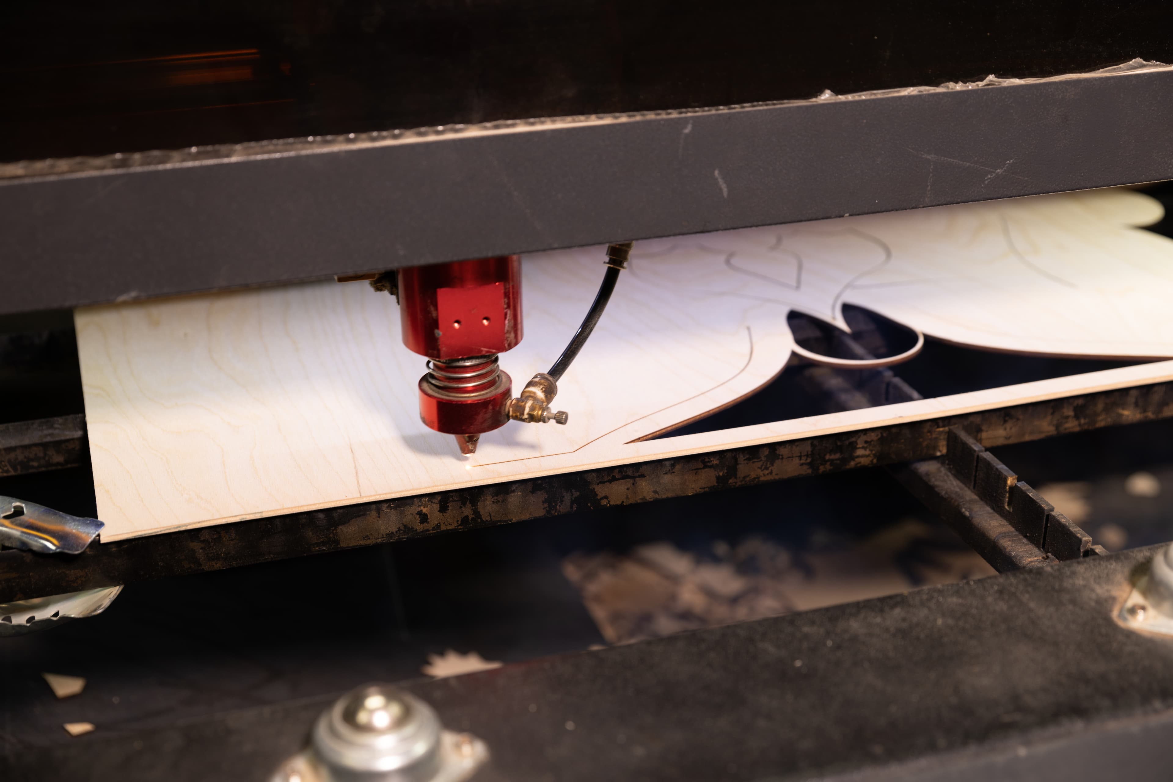 Laser cutter tracing a mandala design