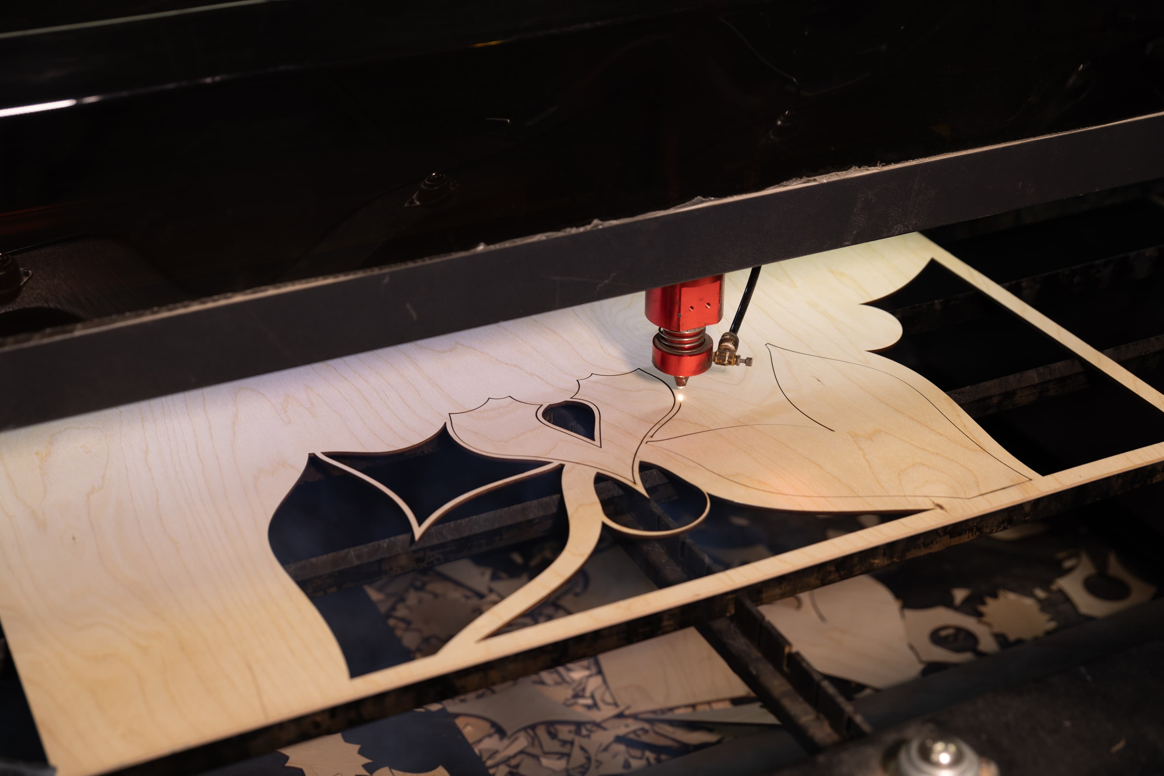 Laser cutting in progress on birch